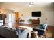 Open-concept living space featuring stylish furnishings, hardwood floors, and natural light at 205 Spring Creek Dr, Mount Holly, NC 28120