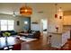 The dining and living area offers abundant natural light, blending comfort and style at 205 Spring Creek Dr, Mount Holly, NC 28120