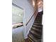 Carpeted staircase leading to a bedroom, offering a glimpse of its interior and fan at 205 Spring Creek Dr, Mount Holly, NC 28120