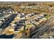 An aerial view of a residential neighborhood shows the density and layout of homes at 221 Brenett Francis Ct, Charlotte, NC 28214
