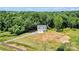 An aerial view showcases this property's secluded location, large lot and easy access to city streets and neighbors at 237 Mariposa Rd, Stanley, NC 28164