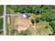 Aerial view of the property's secluded location, nestled among mature trees and ample space for outdoor activities at 237 Mariposa Rd, Stanley, NC 28164