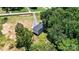 Aerial view of the property and surrounding mature trees offering privacy and a peaceful setting for the home at 237 Mariposa Rd, Stanley, NC 28164