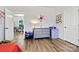A bright bedroom offers ample space and is complemented by a view into the dining room at 237 Mariposa Rd, Stanley, NC 28164