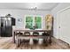 Charming dining area with rustic wood table and ample natural light at 237 Mariposa Rd, Stanley, NC 28164