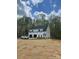 Charming two-story home with a grey exterior, black roof, and a spacious two-car garage on a sprawling lot at 237 Mariposa Rd, Stanley, NC 28164