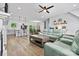 Spacious living room with comfortable seating and a modern kitchen in the background at 237 Mariposa Rd, Stanley, NC 28164