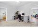Bright office space featuring modern furnishings, neutral carpeting, and a door to another room at 237 Mariposa Rd, Stanley, NC 28164
