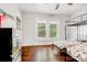 Bright bedroom featuring hardwood floors, bunk beds and ample natural light from the large windows at 2417 Statesville Blvd, Salisbury, NC 28147