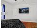 Well-lit bedroom features hardwood floors, black upholstered bed, and scenic wall art above the bed at 2417 Statesville Blvd, Salisbury, NC 28147
