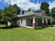 A charming single story home featuring a covered porch, brick pillars and a well maintained lawn at 2417 Statesville Blvd, Salisbury, NC 28147