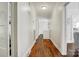 Bright hallway with hardwood floors and white walls, connecting various rooms in the home at 2417 Statesville Blvd, Salisbury, NC 28147