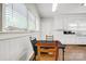 Bright kitchen has white cabinets, stainless steel sink, and laminate wood flooring at 2417 Statesville Blvd, Salisbury, NC 28147