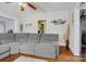 Cozy living room featuring hardwood floors, a large sectional sofa and decorative wall art at 2417 Statesville Blvd, Salisbury, NC 28147