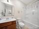Bathroom featuring a vanity with sink, toilet and shower with curtain at 24604 Blue Heron Cir, Lancaster, SC 29720