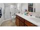 Accessible bathroom featuring a roll-in shower and double sink vanity at 24604 Blue Heron Cir, Lancaster, SC 29720