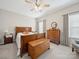 Bedroom featuring a ceiling fan, wood furniture, wooden chest and bright windows at 24604 Blue Heron Cir, Lancaster, SC 29720