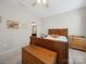 Bedroom featuring a ceiling fan, wood furniture and small wooden chest at 24604 Blue Heron Cir, Lancaster, SC 29720