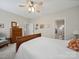 Bedroom featuring a ceiling fan, wood furniture and an ensuite bathroom at 24604 Blue Heron Cir, Lancaster, SC 29720