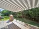Covered deck overlooking wooded backyard at 24604 Blue Heron Cir, Lancaster, SC 29720