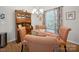 Cozy dining room with wood floors, glass table, wood china cabinet, and natural light at 24604 Blue Heron Cir, Lancaster, SC 29720