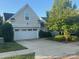Charming home featuring a two-car garage, well-maintained lawn, and mature landscaping providing curb appeal at 24604 Blue Heron Cir, Lancaster, SC 29720