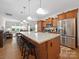 Spacious kitchen with a large center island, stainless steel appliances, and barstool seating at 24604 Blue Heron Cir, Lancaster, SC 29720