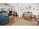 Open living room with hardwood floors connecting to another seating area at 24604 Blue Heron Cir, Lancaster, SC 29720