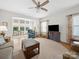 Spacious living room with hardwood floors and a view into the breakfast area at 24604 Blue Heron Cir, Lancaster, SC 29720