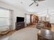 Open living room with hardwood floors, a ceiling fan, and a view into the kitchen at 24604 Blue Heron Cir, Lancaster, SC 29720