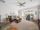 Bright living room with hardwood floors, a ceiling fan, and neutral paint colors at 24604 Blue Heron Cir, Lancaster, SC 29720