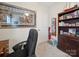 Home office with neutral walls and carpet, wood bookshelf, and natural light at 24604 Blue Heron Cir, Lancaster, SC 29720
