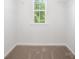 A walk-in closet with a window and wire shelving at 3001 Sadler Woods Ln, Charlotte, NC 28214