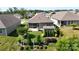 Aerial view of a home featuring a landscaped backyard and a screened-in porch at 320 Secretariat Dr, Iron Station, NC 28080