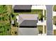 Aerial view of the property showcasing the roof, driveway, and landscaped yard at 320 Secretariat Dr, Iron Station, NC 28080