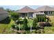 Landscaped backyard with patio, screened-in porch, and a shed at 320 Secretariat Dr, Iron Station, NC 28080