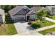 Beautiful home with a well-manicured lawn, lovely landscaping, and a two-car garage at 320 Secretariat Dr, Iron Station, NC 28080