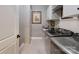 Efficient laundry room with modern washer and dryer units, ample storage, and counter space for folding at 320 Secretariat Dr, Iron Station, NC 28080