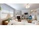 Cozy living room with a fireplace, natural light from a large window, and neutral decor at 320 Secretariat Dr, Iron Station, NC 28080