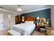 Comfortable main bedroom with hardwood floors, dark accent wall and a wooden furniture set at 320 Secretariat Dr, Iron Station, NC 28080
