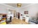 This office boasts hardwood floors and a stylish hanging lamp at 320 Secretariat Dr, Iron Station, NC 28080
