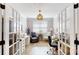 Bright office space with glass French doors, natural light, and hardwood floors, perfect for remote work at 320 Secretariat Dr, Iron Station, NC 28080