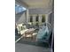 Inviting screened-in porch with comfortable seating and stylish decor for relaxing and entertaining at 320 Secretariat Dr, Iron Station, NC 28080