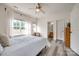 Bright bedroom with natural light, ceiling fan, and view of green backyard at 325 Hancock Union Ln, Rock Hill, SC 29732