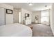 Spacious carpeted bedroom with large window and TV mounted on the wall at 325 Hancock Union Ln, Rock Hill, SC 29732
