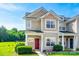 Charming townhome showcasing manicured landscaping and a striking red front door at 325 Hancock Union Ln, Rock Hill, SC 29732