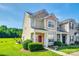 Charming two-story home with a well-manicured front yard and inviting red door at 325 Hancock Union Ln, Rock Hill, SC 29732