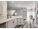 Open kitchen with breakfast bar, modern appliances, and natural light at 325 Hancock Union Ln, Rock Hill, SC 29732