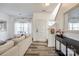 Bright living room with wood floors, a comfortable couch, and staircase at 325 Hancock Union Ln, Rock Hill, SC 29732