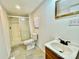 Bathroom featuring a glass-enclosed shower, modern vanity, and neutral tile flooring at 325 Scaley Bark Dr, Salisbury, NC 28147